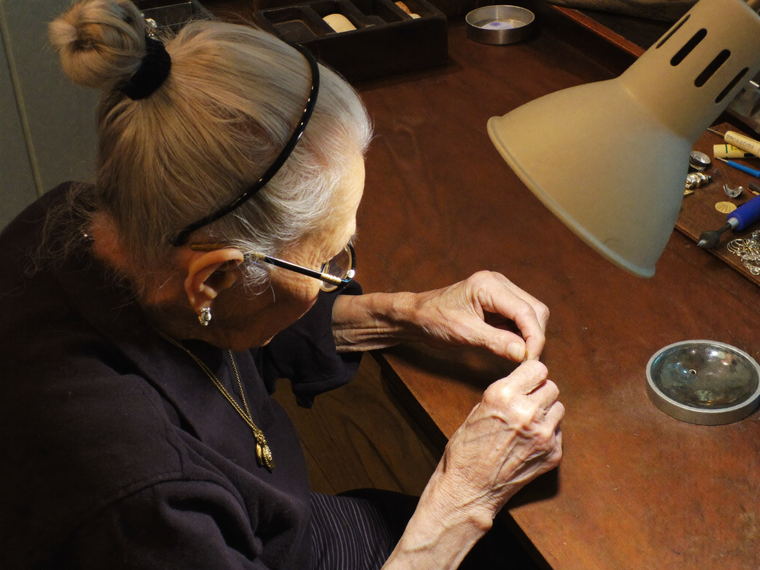 Margaret Prescott working at her jeweler's bench