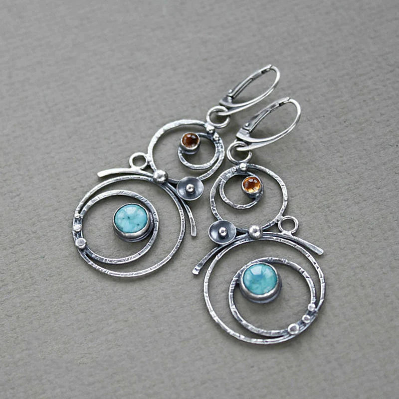 Earrings with blue and orange stones