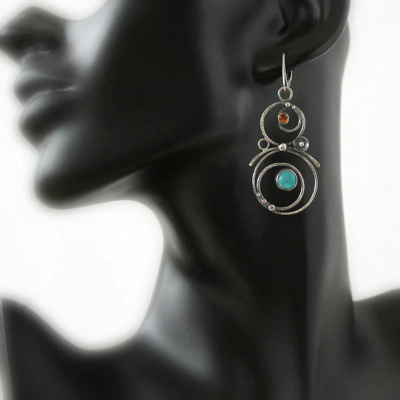 Earrings with blue and orange stones