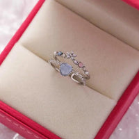 Adjustable silver ring with blue stone and zirconia