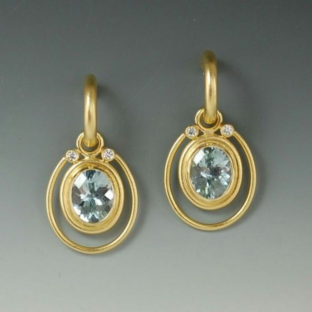Vintage gold earrings with light blue crystal