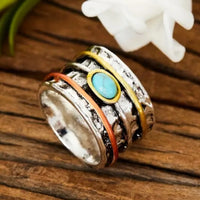 Silver ring with light blue gemstone