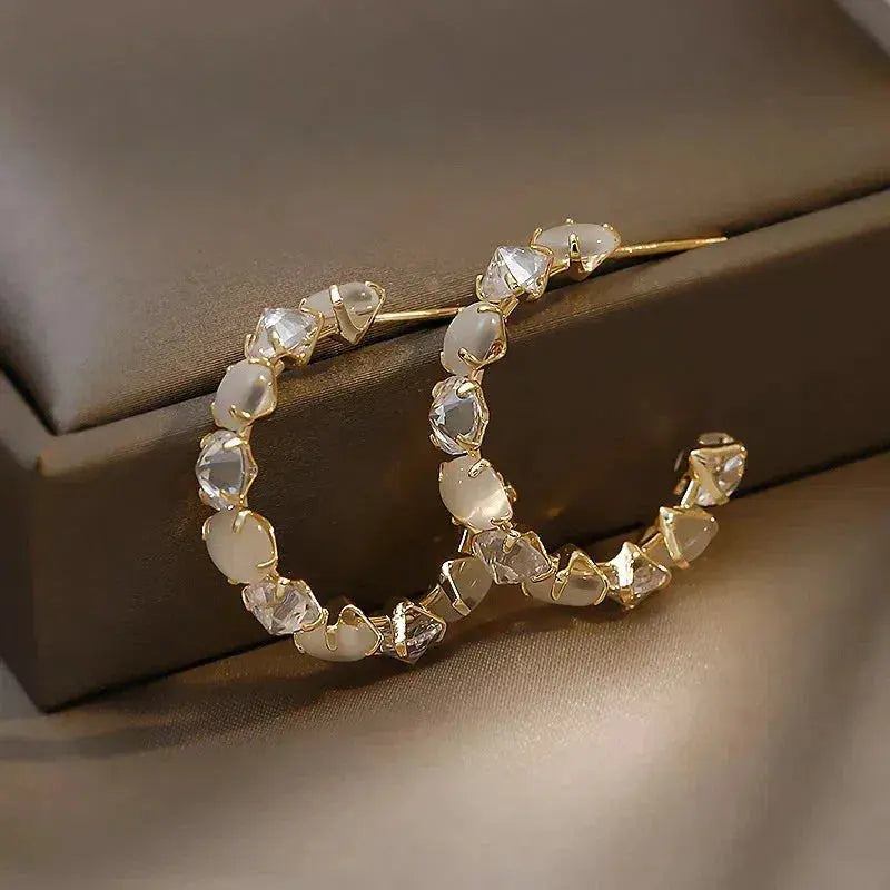 White opal with zirconia earrings in gold