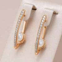 Elegant earrings with rhinestones and pearls