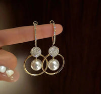 Luxury earrings with cultured pearls and zircons