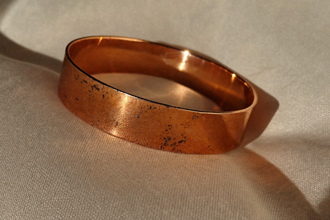 The copper Judy wears — solid, magnet-tested, guaranteed for life